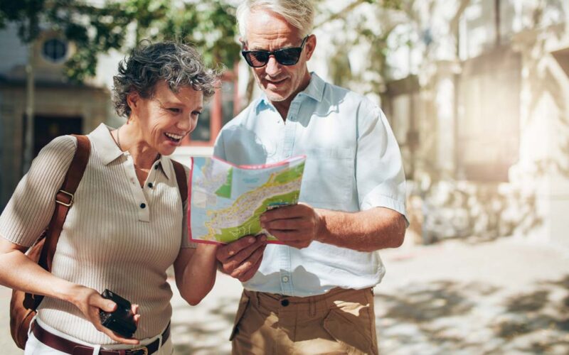 bigstock-Senior-Couple-Reading-A-Touris-138316946